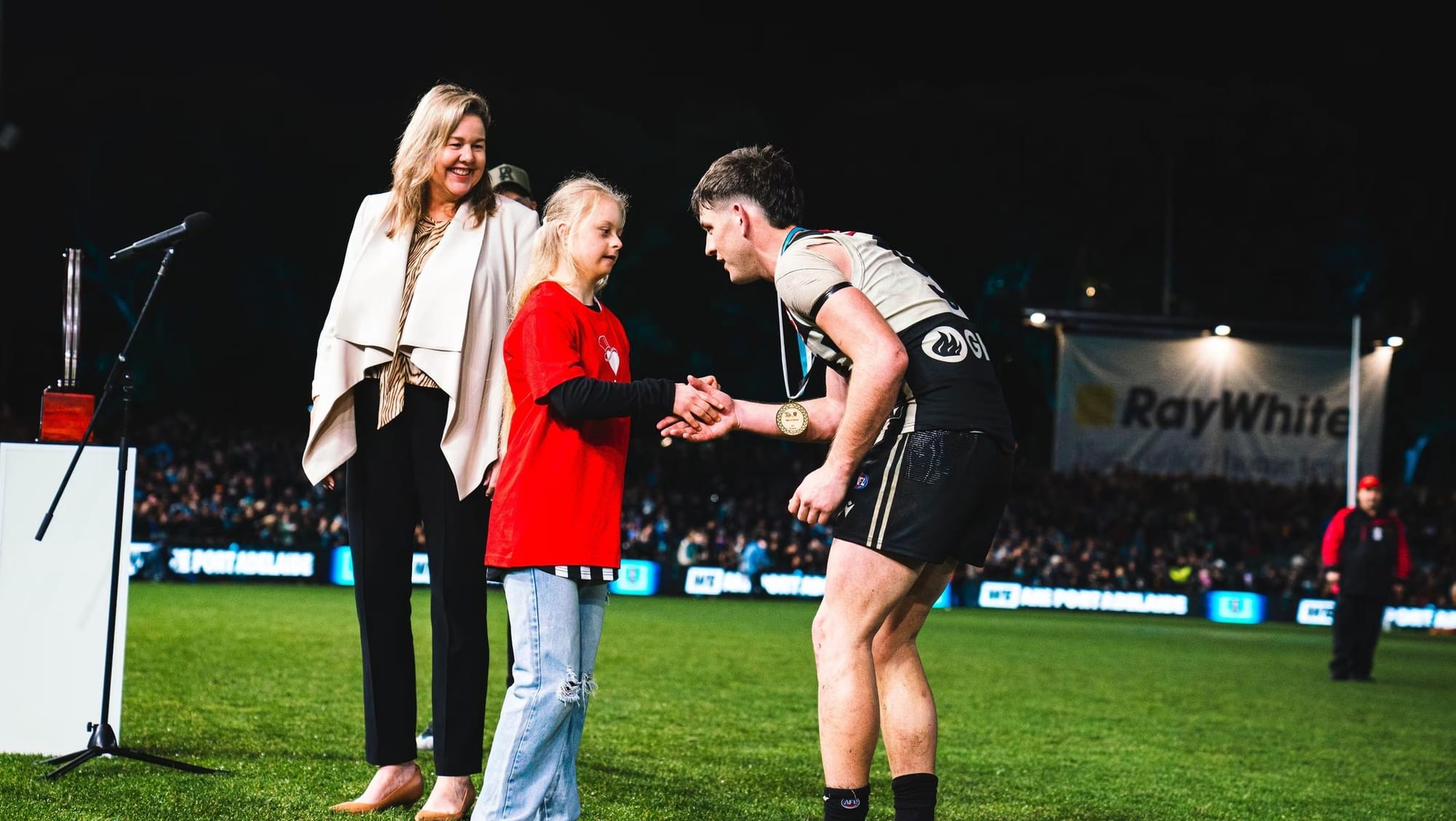 Local teenager reunited with Port Adelaide hero