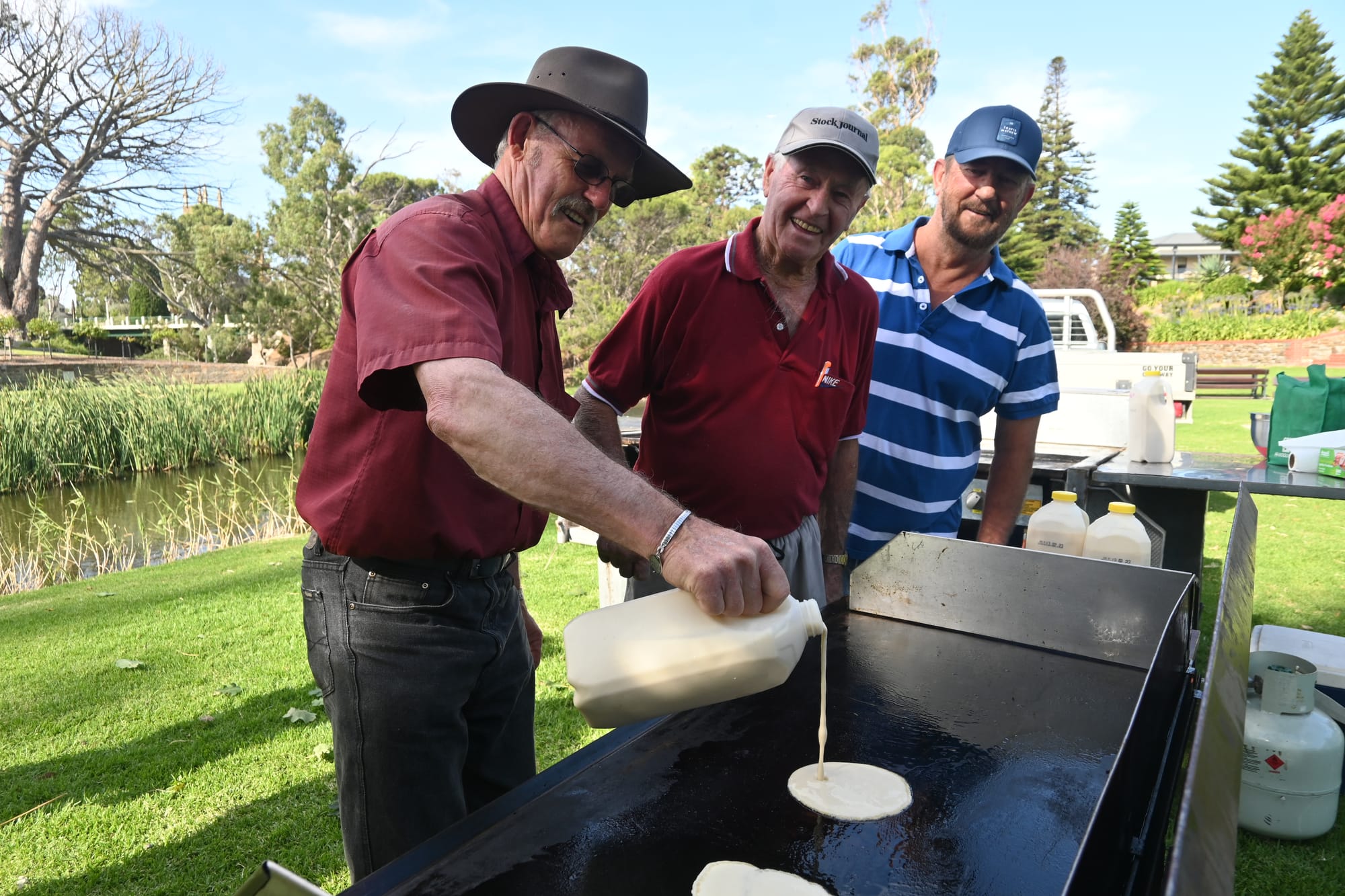 Pouring pancakes in the park for annual tradition