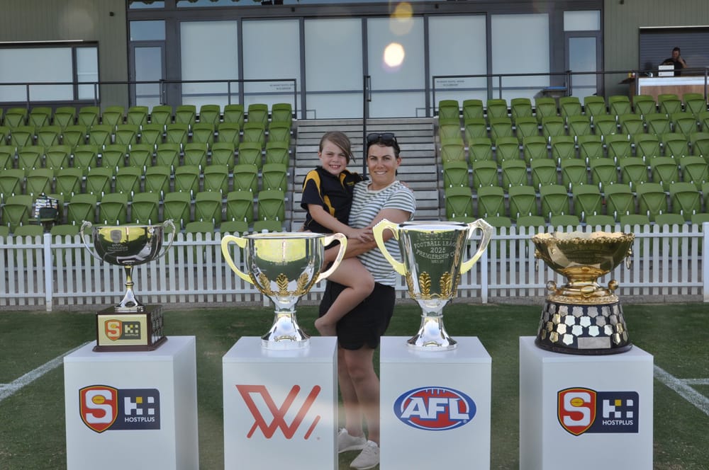 Locals get up close and personal with footy silverware post image