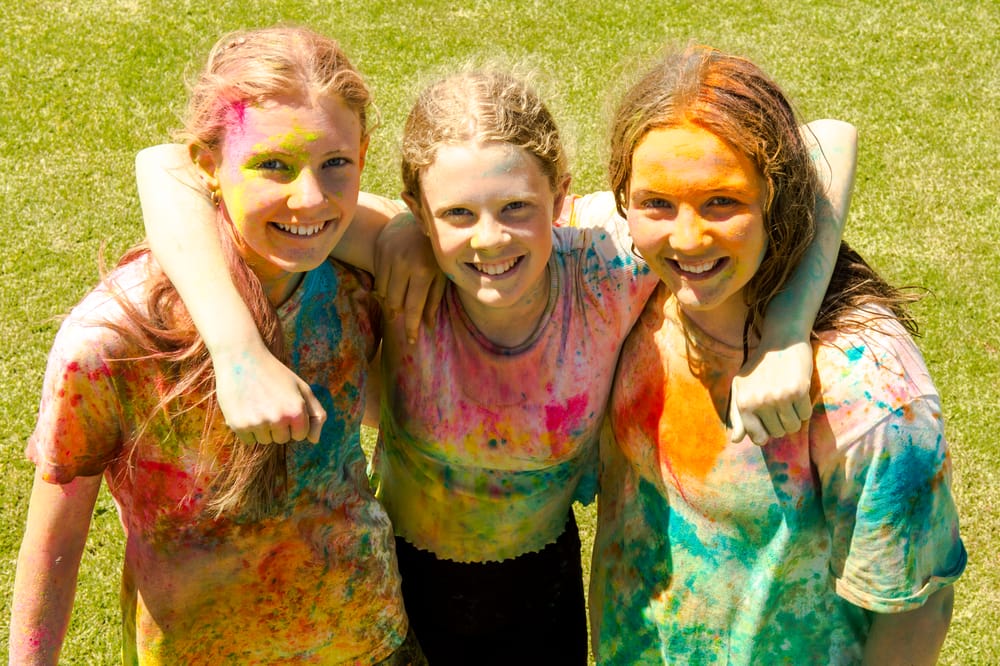 ALL SMILES: Goolwa College students splashed with colour post image