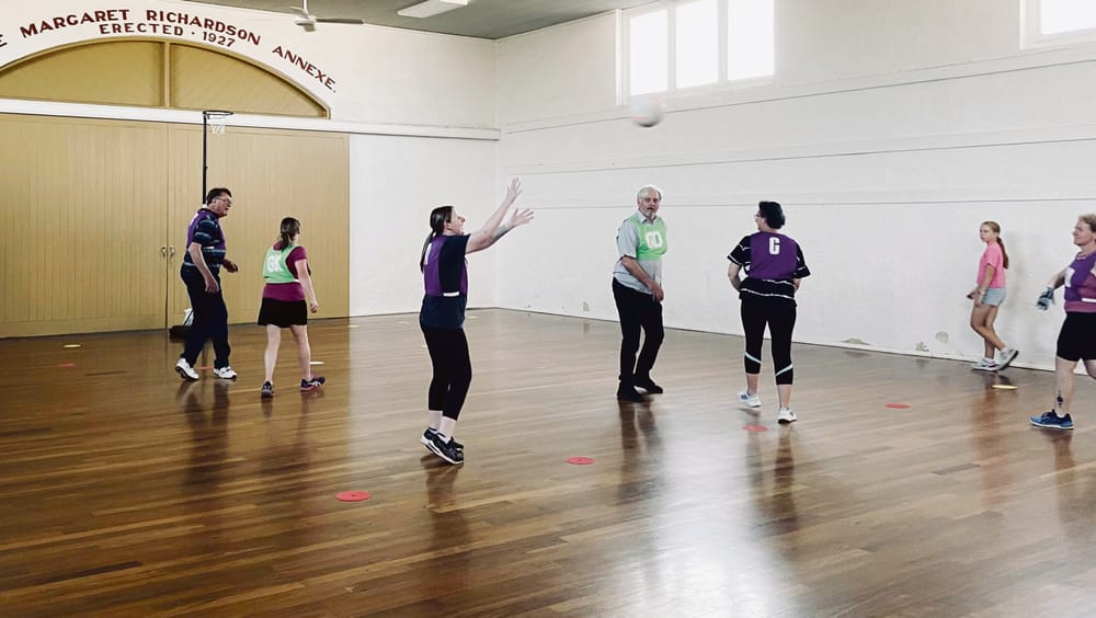 Strathalbyn netballers taking a walk inside show hall post image