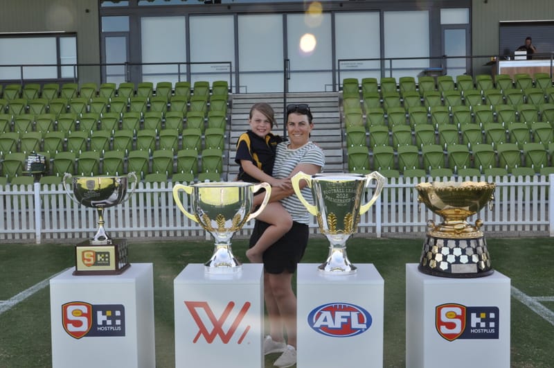 Locals get up close and personal with footy silverware post image